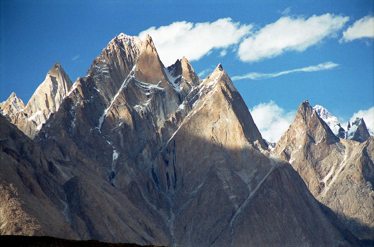 04 K2 Pokes Out To The Right Of The Cathedral Just Before Sunset From Paiju I was admiring the Cathedral and a bit of the Lobsang Spire in the late afternoon from Paiju when I noticed a tall peak far away poking out in the distance. I strained my eyes and couldnt believe it  its K2.